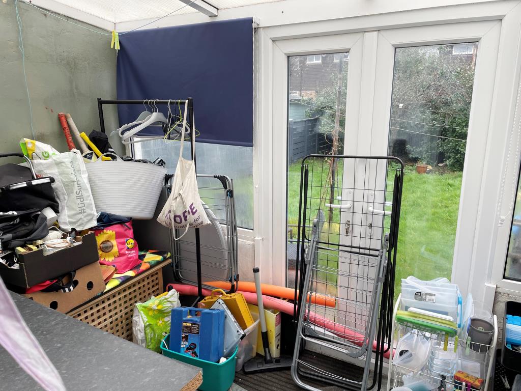 Lot: 65 - DETACHED BUNGALOW IN NEED OF UPDATING - View of glazed store at rear